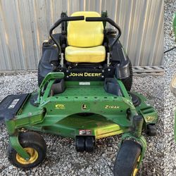John Deere Z920M 60” zero turn, new battery and rear tires. Starts up runs great.
