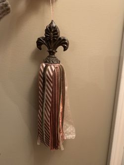 Hanging tassels (2) in brown/pink colors. 13” long.