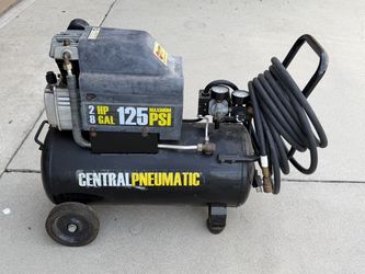 Central pneumatic, 2 HP, 125 PSI, with hose.