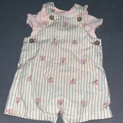 Pink and white striped romper with small floral print