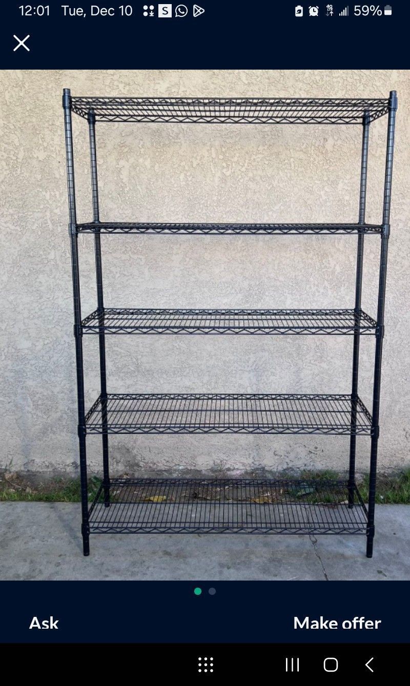 ONE BLACK METAL RACK WITH FIVE SHELVES ( USED IT FOR ONE WEEK ) $ 65.00