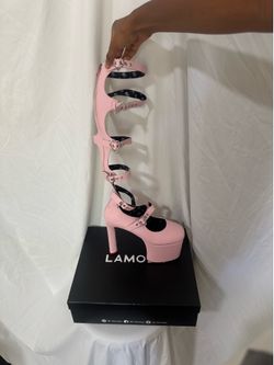 Pink platform heels with heart-shaped buckle