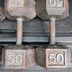 PAIR OF 50 LB.  STEEL   DUMBBELLS