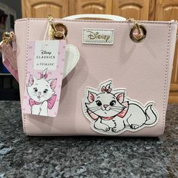 Disney Marie Small Tote Crossbody Pink Mini Bag Primark exclusive.  With handles and the long strap is removable. Brand new with tags.  Smoke free hom