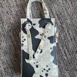 The cow print and floral design handbag