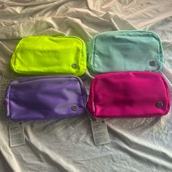 Lululemon bundle four brand new everywhere, belt bag, summer color, set, sonic, pink, neon, green, blue and purple