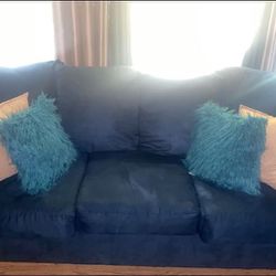 Teal blue loveseat and couch