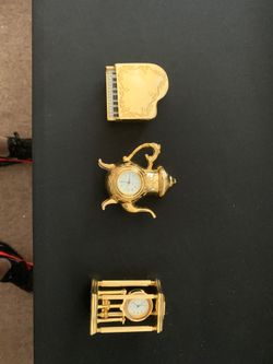 Golden miniature clocks