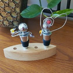 2 Silver Wine Bottle Stoppers with Heart Design & Stand