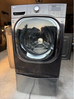 LG 5.2 Cu.Ft capacity Twin-wash front load washer. It includes a sidekick pedestal washer.