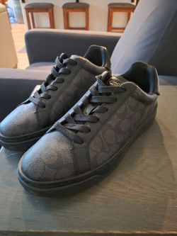 Coach blacked out low top shoes