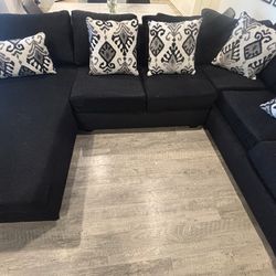 Couches with ottoman and pillows