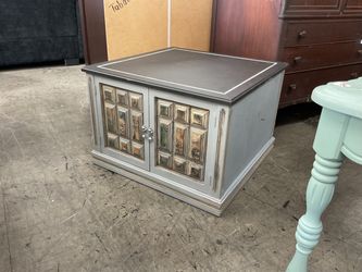 Gray Painted Cabinet with Decorative Panel Doors