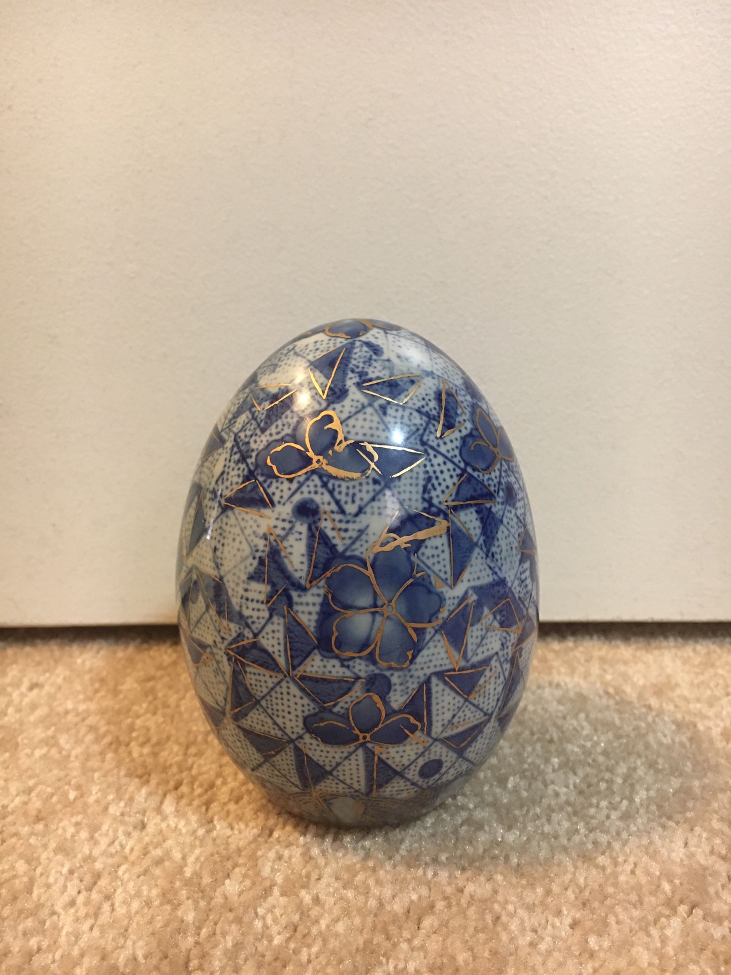 Blue, white, and gold porcelain egg