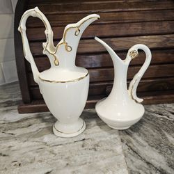 vintage white porcelain decorative pitchers or bud vases featuring hand-painted gold trim and accents.