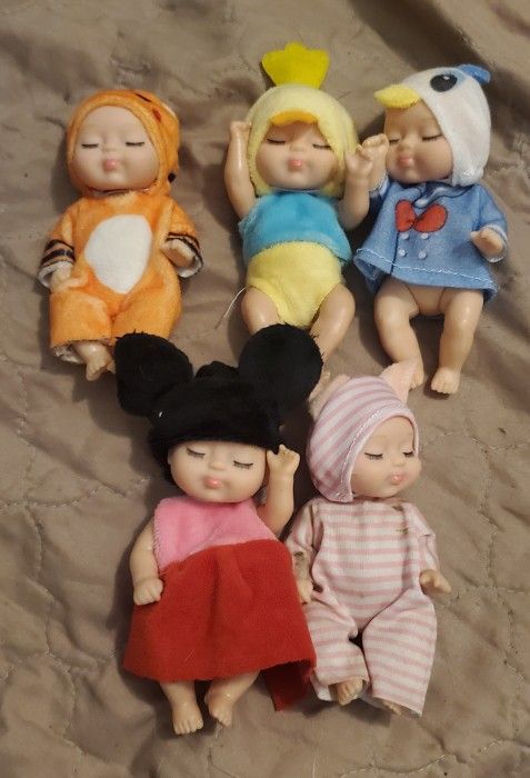 5 Mini Dolls Dressed In Animal Costumes.