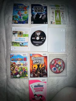 Nintendo Wii Bundle + Wii Fit Board + Guitar Hero Guitar + 2 Controllers + 8 Games
