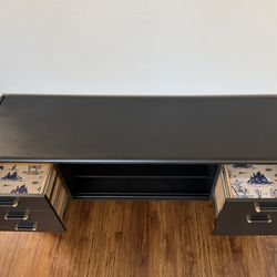 Black Desk Or Entertainment Center With Cowboy Wallpaper Drawers