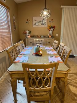 Dining table with eight chairs in a hutch