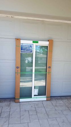 Brand New 30"W x 59"H PGT WinGuard Impact Sliding Window