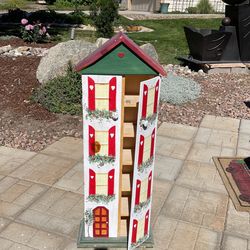 Handmade and hand painted shelves that looks like a doll house