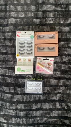 Fake eyelashes and adhesive