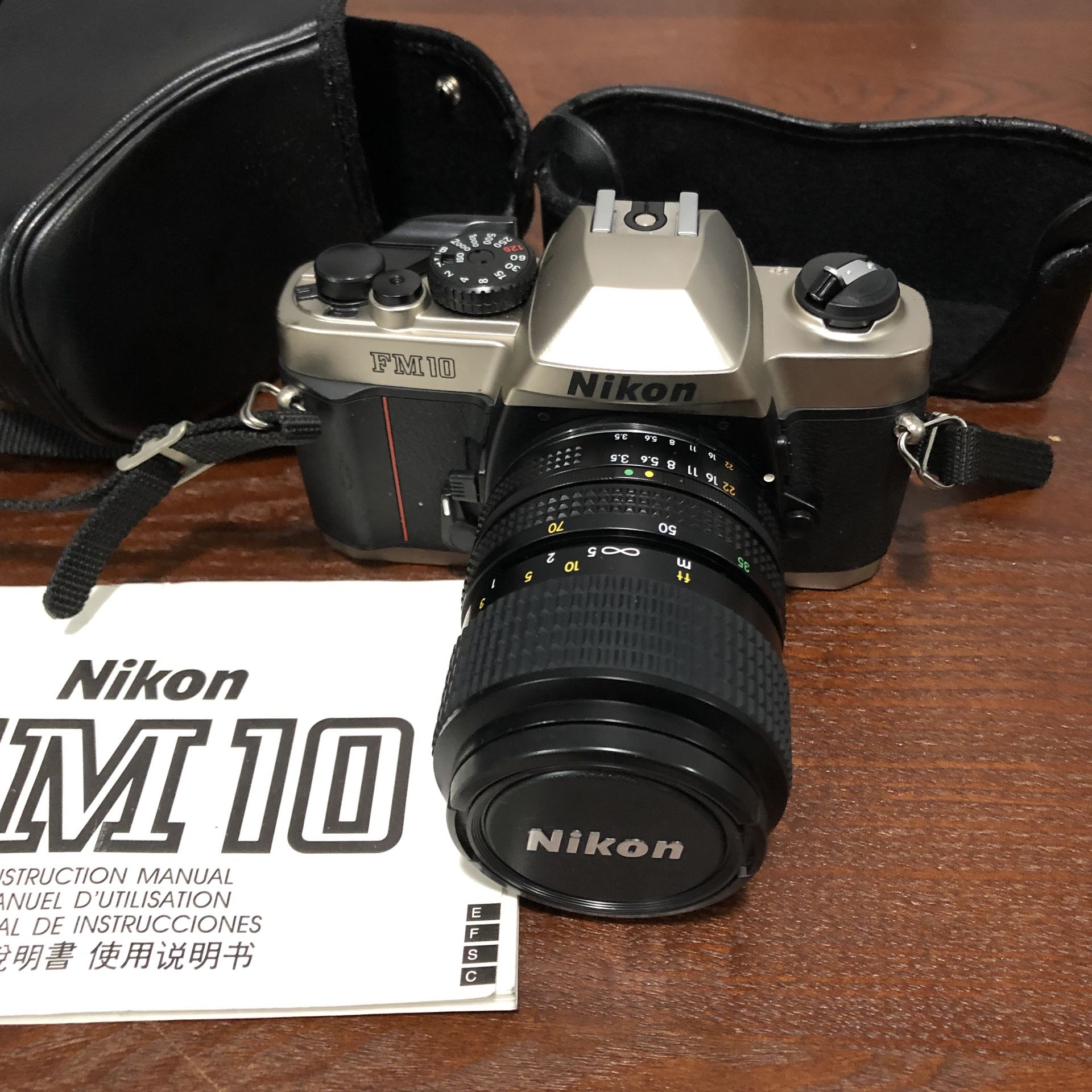Nikon FM-10 35mm SLR Camera Kit with 35-70mm F3.5-4.8 Zoom Lens & Camera Case