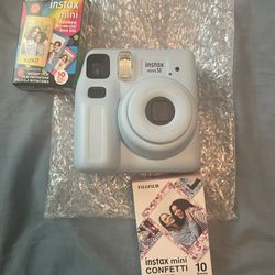 New Light Blue Instax Mini And Two Film Packs