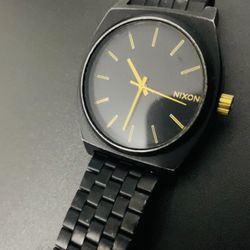 Nixon Time Teller Black, gold-tone hands and hour markers.