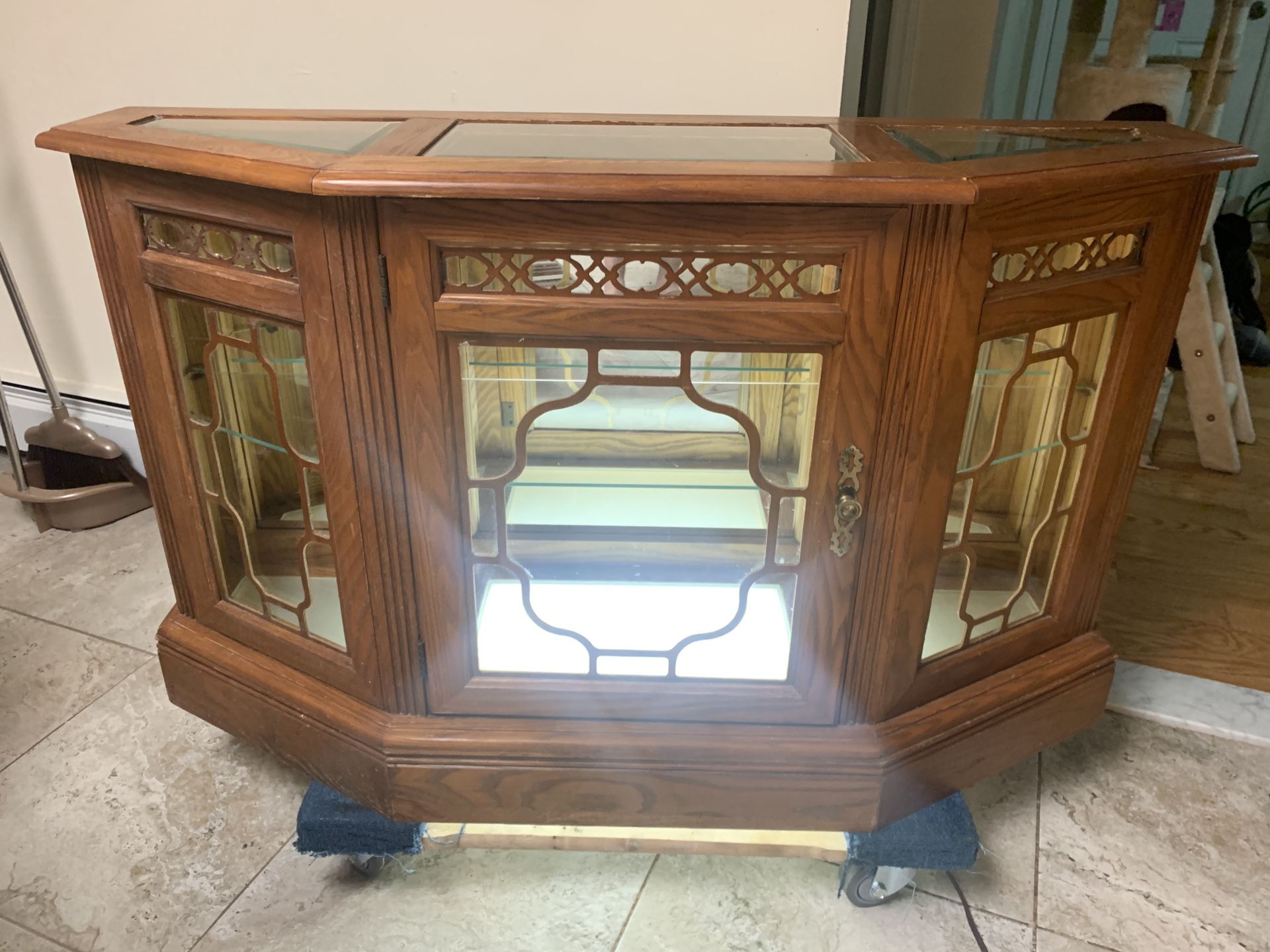 Traditional style glass/mirrored showcase. (TV stand). 48"W x 15"D x 29"H Good condition