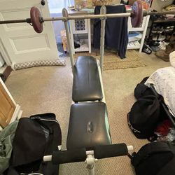 Benchpress With Bar And About 100lbs Of Weight