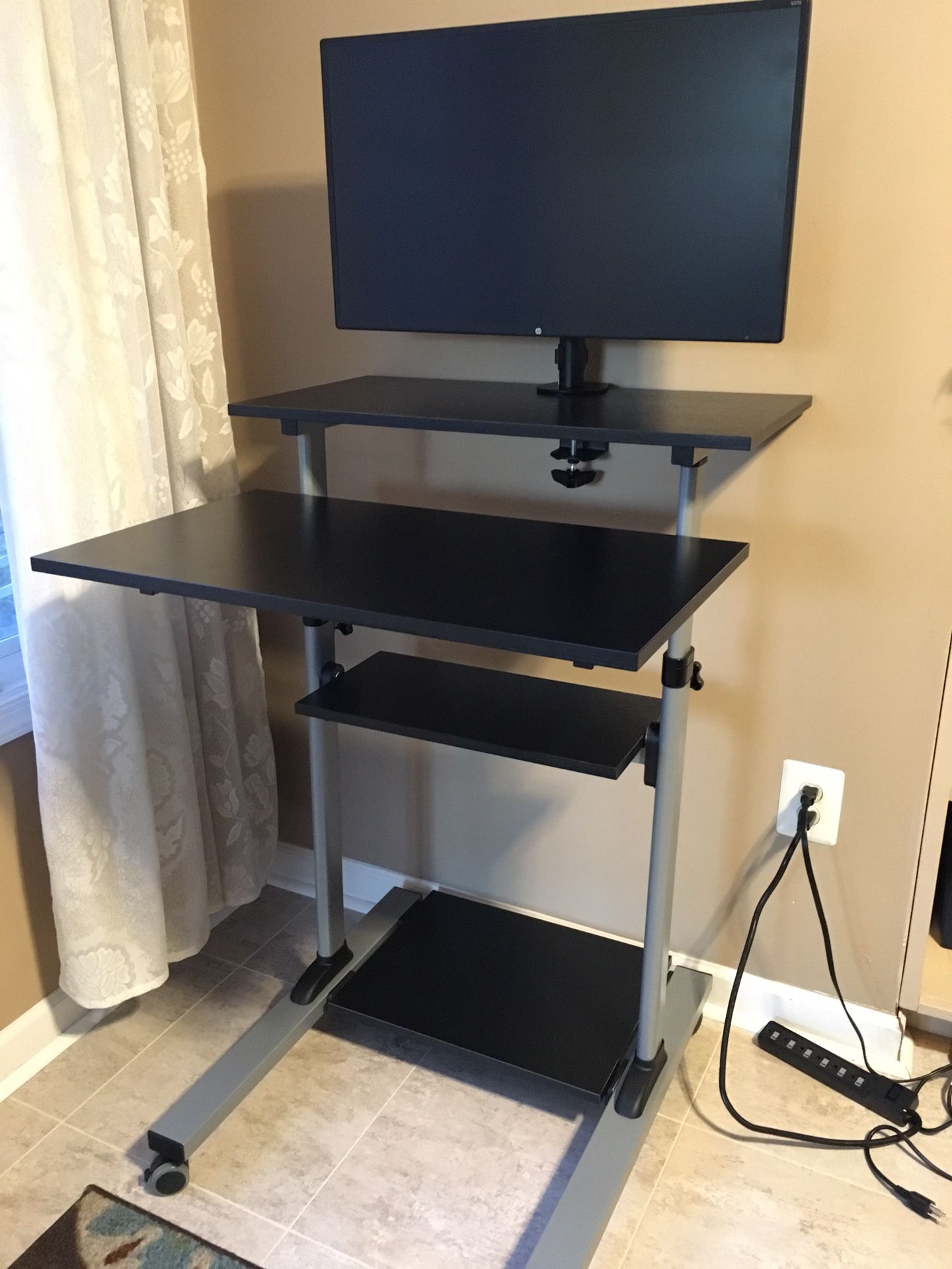 2 Tier adjustable height Computer table with rollers. (Monitor attached is not included)