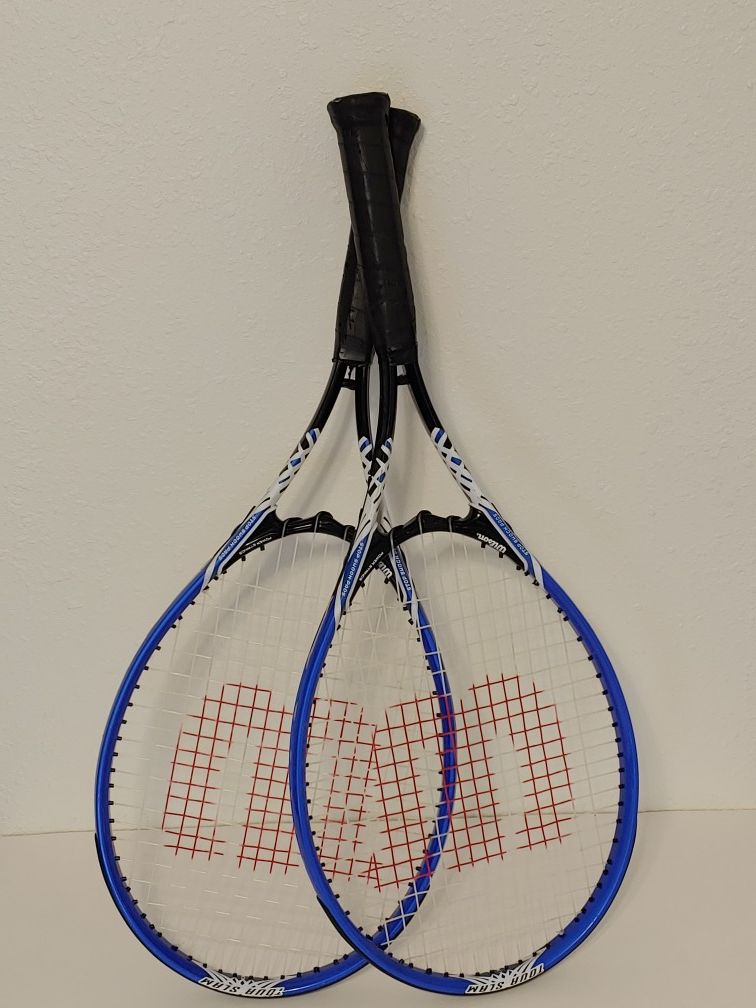 Pair of Wilson tennis rackets. Grips have light ware