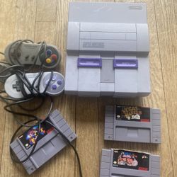 Super Nintendo with the cords And Games 