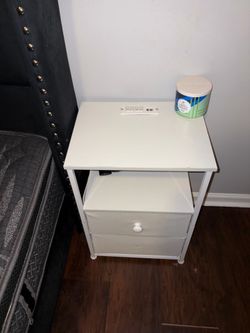 White LED nightstand with outlets.