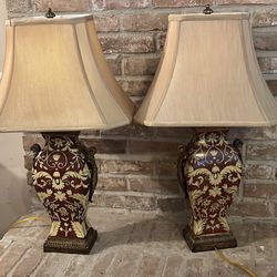 Elegant red and cream high end pair of table lamps.  From a family estate.  30 in tall 