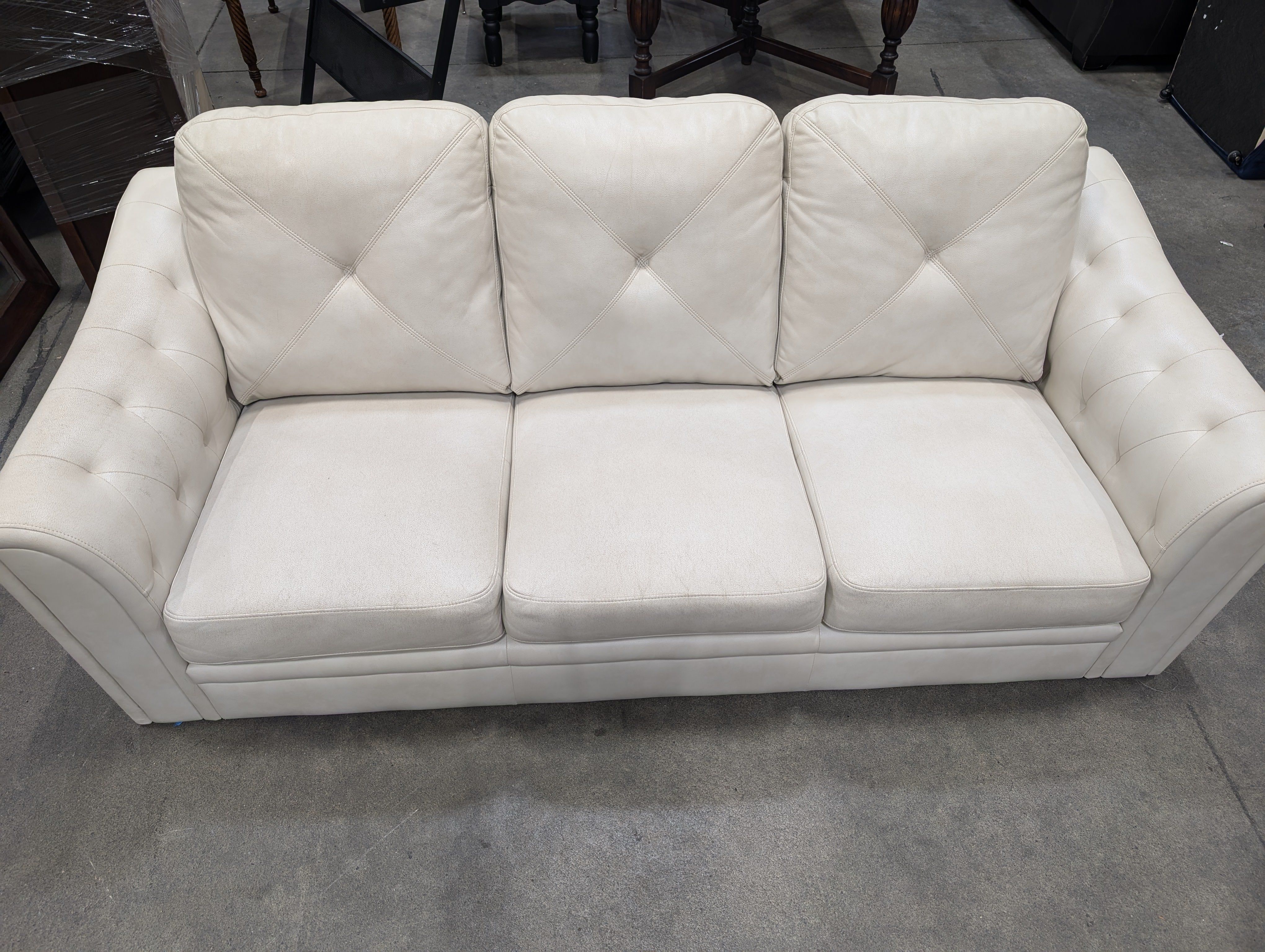 Light Beige Tufted Three-Seater Sofa