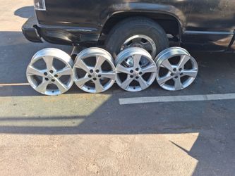 Four 16 inch tire rims