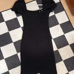 ribbed mini dress featuring puff sleeves and a white bow detail