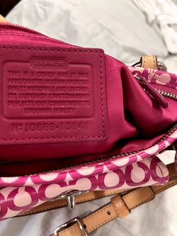 This is a Coach Op Art Leah pink convertible crossbody bag. Includes wallet.