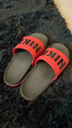 Red Nike slides 10