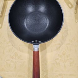 New, never used 11 in light weight cast iron deep wok like skillet.