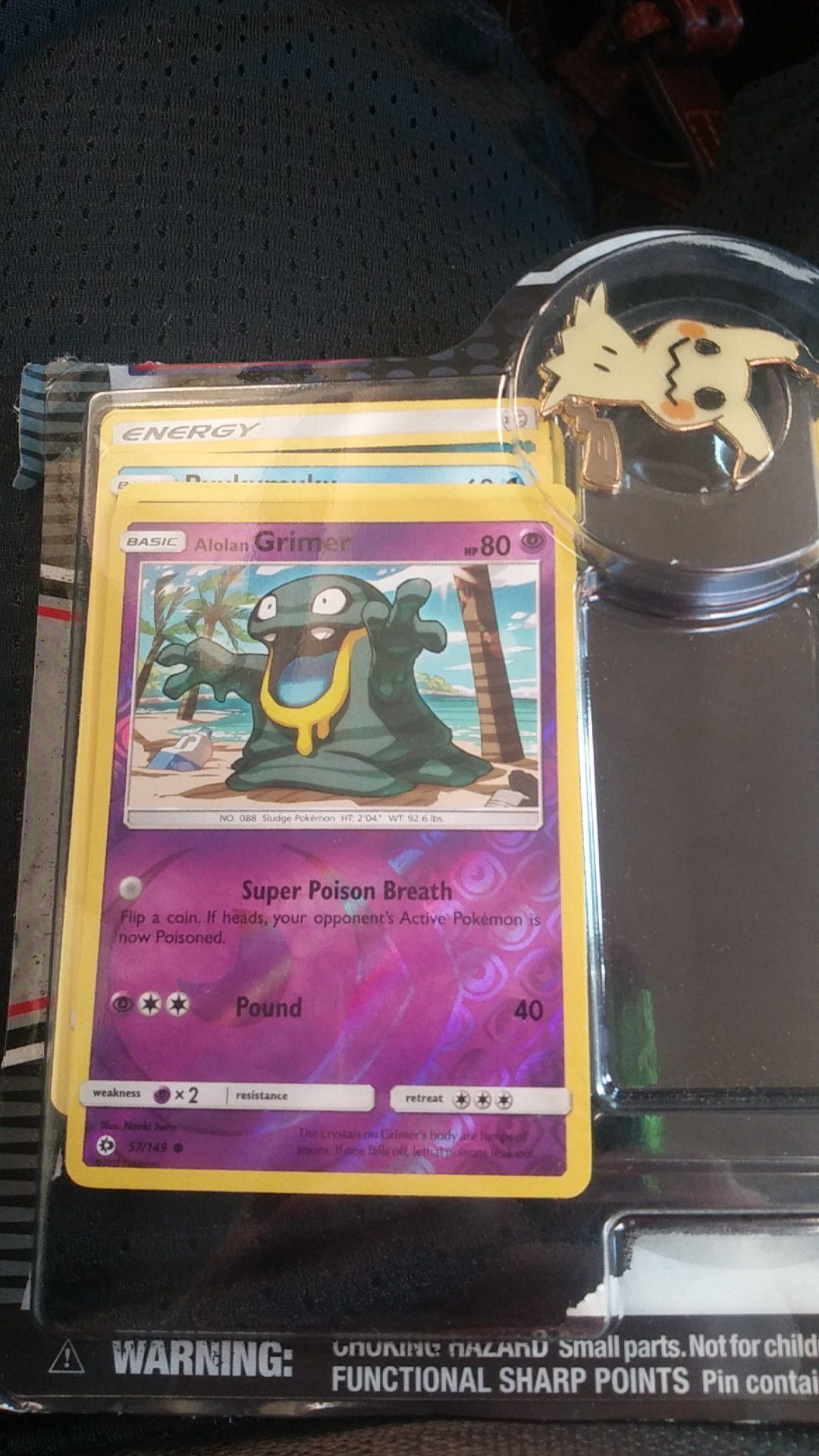 2 shiny cards and multiple others and a pin