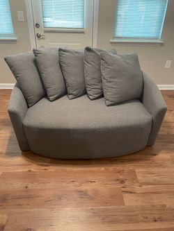 Gray Round Loveseat with Throw Pillows