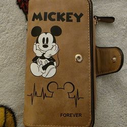 brown Disney Mickey Mouse "Forever" long clutch wallet featuring a graphic of Mickey Mouse and a heartbeat line.