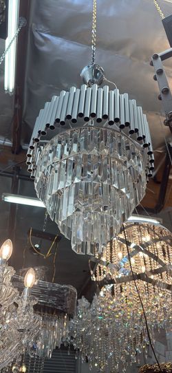 Modern tiered crystal and chrome pipe chandelier