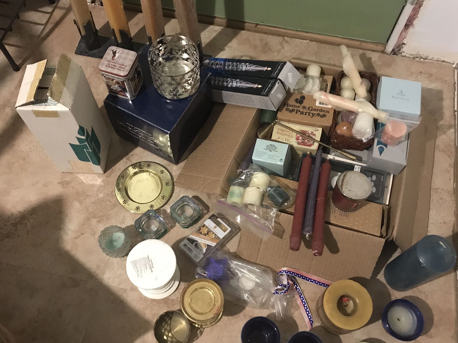 Assorted candles and holders