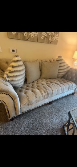 Chesterfield sofa, loveseat, and armchair with matching hexagon shaped coffee table, and end tables