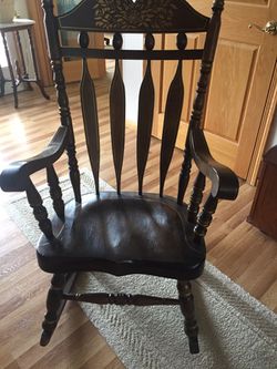 Wooden rocking chair with gold trim