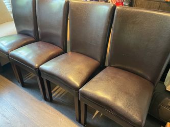 Set of large brown leather dining chairs